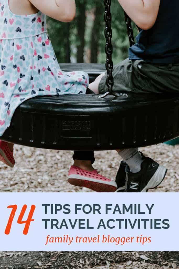 image of kids on tire swing with text overlay 14 tips for family travel activities from family travel bloggers