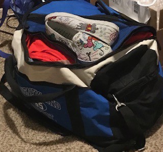 image of duffle back packed for Disneyland from Disabled Disney