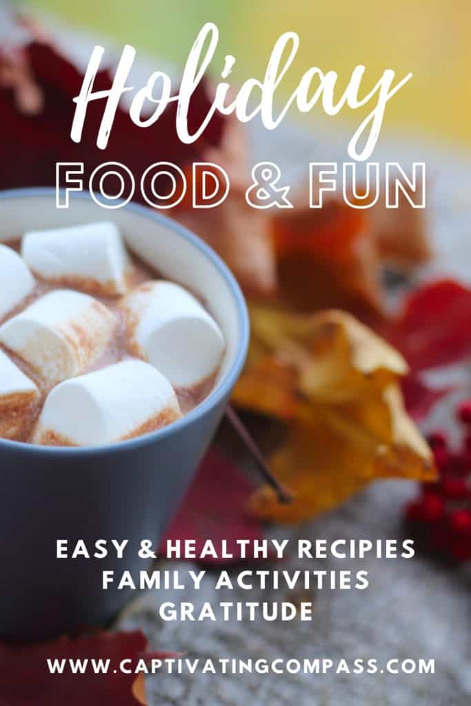 image of hot cocoa with marshmallows wit text overlay. HOliday food family & fun from www.captivatingcompass.com